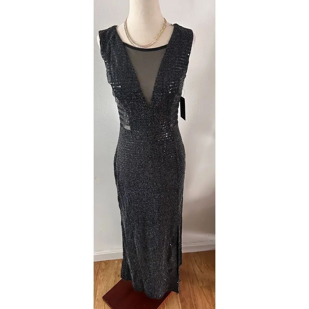 Alexa B fancy going out dress size 4 stretchy black with cut outs slit at the bo